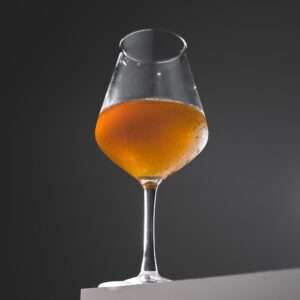 teku glass filled with Cempazuchil imperial wood-aged cider